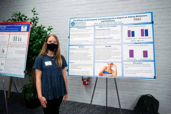 Claire Stone (McNair Scholar) presenting a research poster